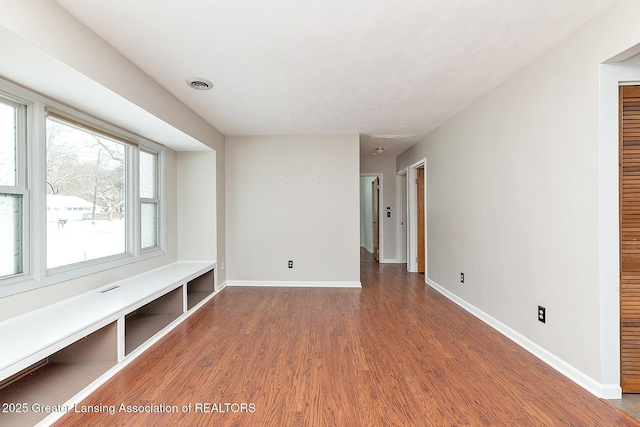 spare room featuring dark hardwood / wood-style floors