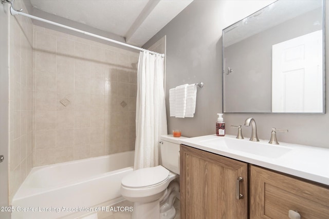 full bathroom with shower / tub combo with curtain, vanity, and toilet