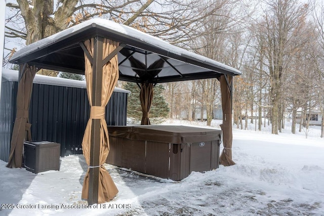 exterior space with a gazebo and a hot tub