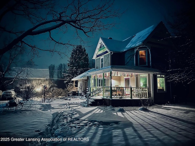7761 W Herbison Rd, Dewitt, MI 48820 - snow covered rear of property with a porch