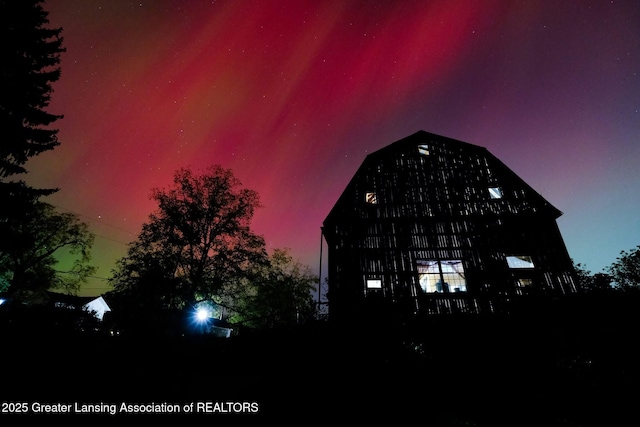 7761 W Herbison Rd, Dewitt, MI 48820 - property at dusk featuring a barn