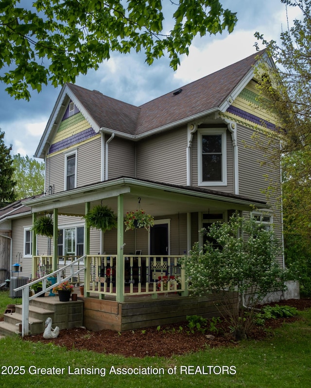 7761 W Herbison Rd, Dewitt, MI 48820 - victorian home featuring a porch and roof with shingles