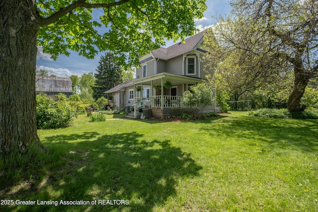 7761 W Herbison Rd, Dewitt, MI 48820 - view of front facade with a porch and a front yard