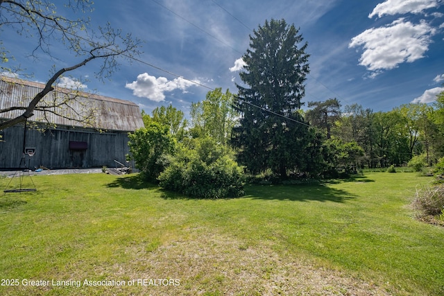 7761 W Herbison Rd, Dewitt, MI 48820 - view of grassy yard with a barn and an outdoor structure