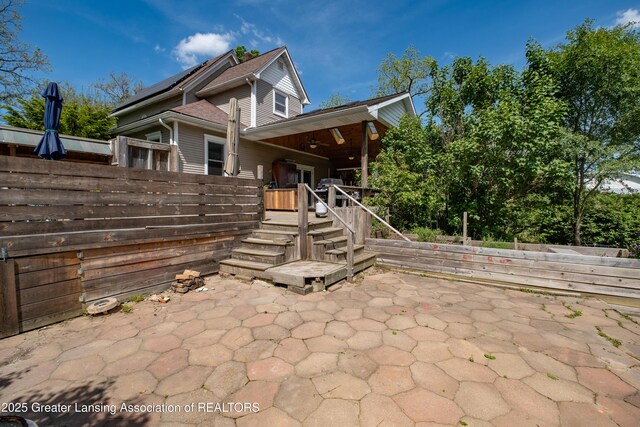 7761 W Herbison Rd, Dewitt, MI 48820 - view of patio / terrace with stairway and ceiling fan