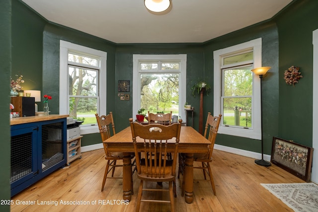 7761 W Herbison Rd, Dewitt, MI 48820 - dining area featuring baseboards and light wood-type flooring
