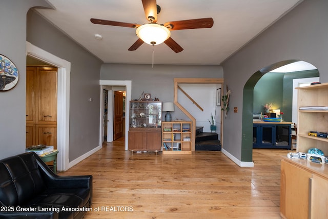 7761 W Herbison Rd, Dewitt, MI 48820 - interior space with arched walkways, light wood-type flooring, stairs, and baseboards
