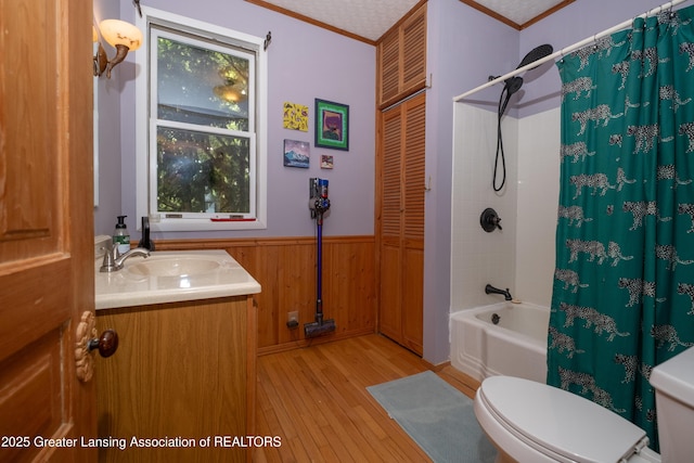 7761 W Herbison Rd, Dewitt, MI 48820 - bathroom with toilet, hardwood / wood-style flooring, shower / bath combination with curtain, crown molding, and vanity