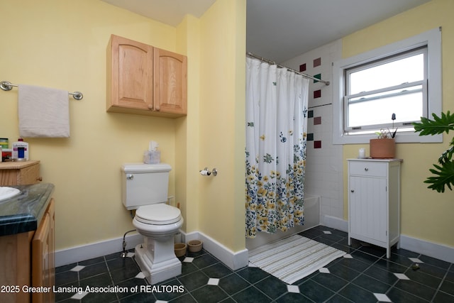 7761 W Herbison Rd, Dewitt, MI 48820 - full bathroom with toilet, vanity, shower / bath combo with shower curtain, and tile patterned floors