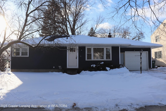 single story home featuring a garage