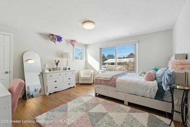 bedroom with light wood-type flooring