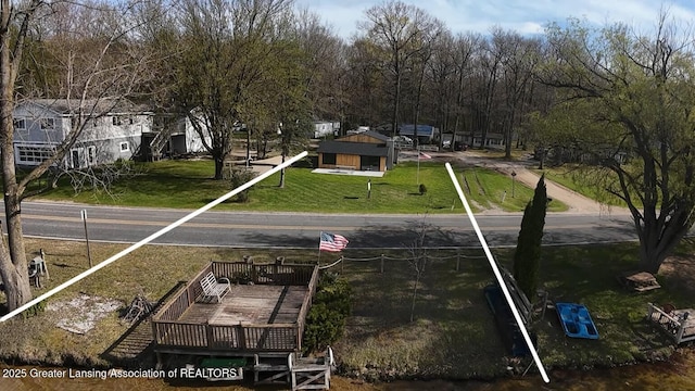 view of home's community with a yard