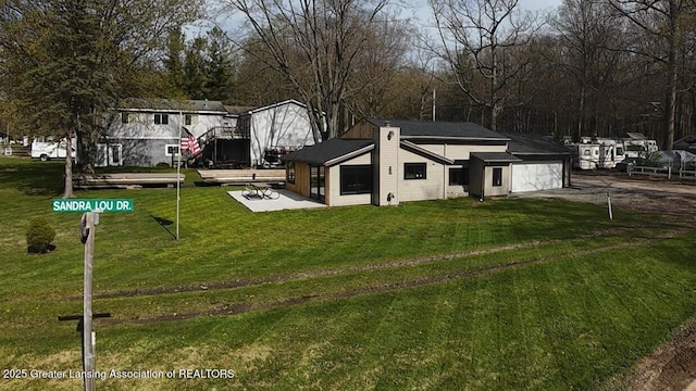 view of front of house with a front lawn and driveway