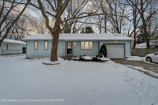 ranch-style home featuring an attached garage