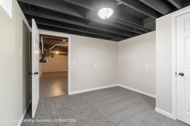 finished basement featuring carpet and baseboards