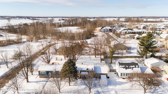 snowy aerial view featuring a residential view