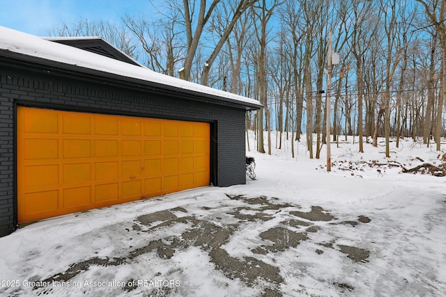 view of snow covered garage