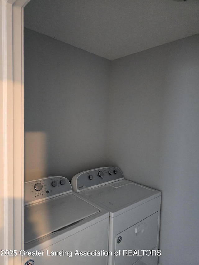 clothes washing area featuring laundry area and independent washer and dryer