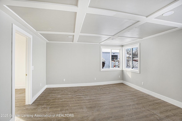 unfurnished room with coffered ceiling, baseboards, and wood finished floors