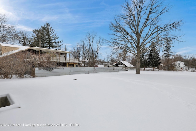 view of yard layered in snow