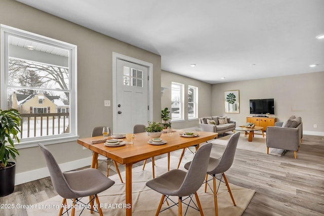 dining area featuring light wood-type flooring, baseboards, and recessed lighting