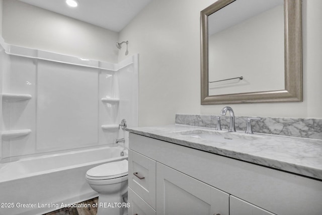 full bathroom featuring vanity, toilet, and shower / bathtub combination