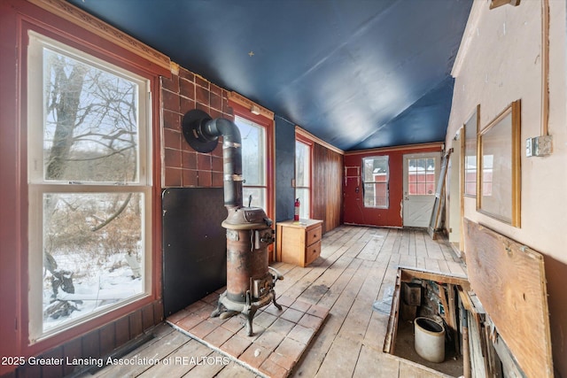 entryway with lofted ceiling and light wood-style flooring