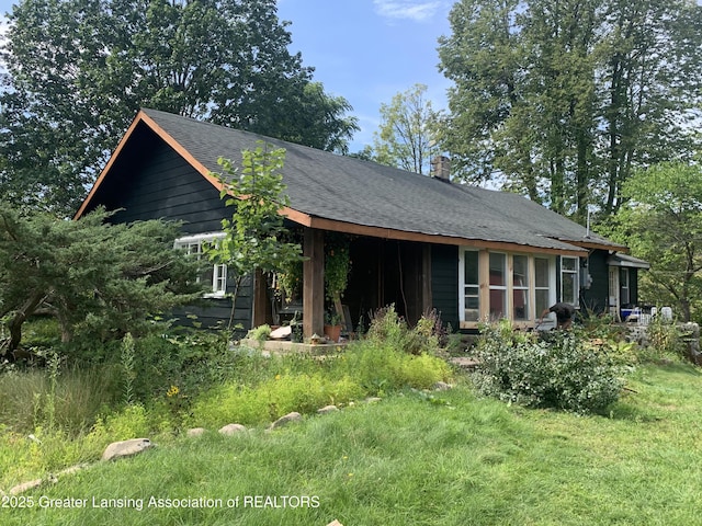 view of front of house with roof with shingles