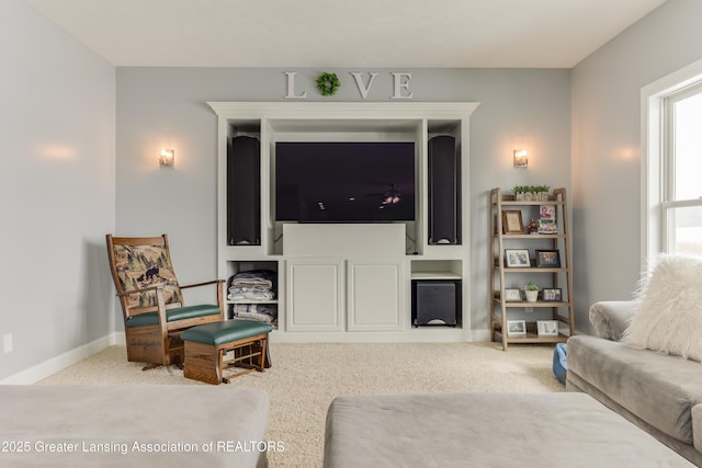 living room with carpet floors and baseboards