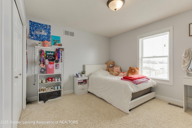 bedroom featuring visible vents and baseboards