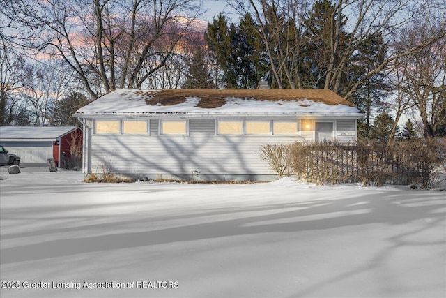 view of snow covered garage