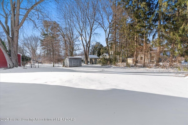 view of yard covered in snow