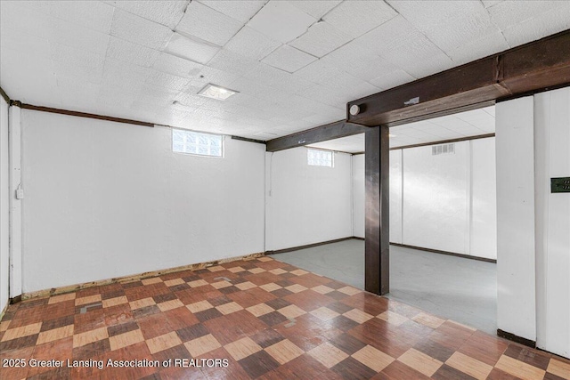 basement with tile patterned floors