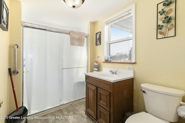 full bath with toilet, a stall shower, and vanity