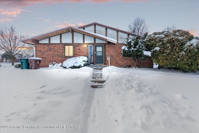 view of front of property featuring brick siding