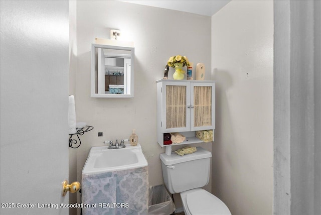 bathroom with a sink and toilet