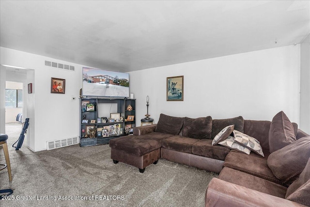 living room featuring carpet floors and visible vents