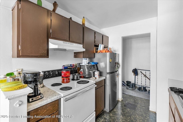 kitchen with electric stove, light countertops, freestanding refrigerator, dark brown cabinetry, and under cabinet range hood