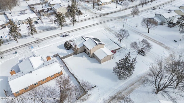 snowy aerial view with a residential view