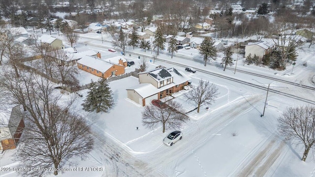 snowy aerial view featuring a residential view