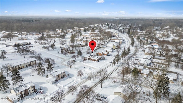 snowy aerial view featuring a residential view