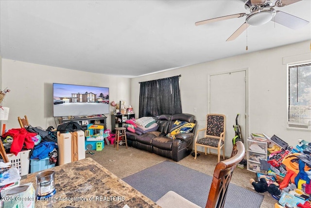 living room with carpet flooring and ceiling fan