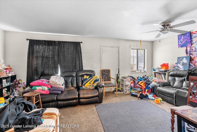 living room with ceiling fan and carpet flooring