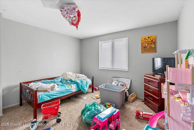 bedroom with baseboards and light colored carpet