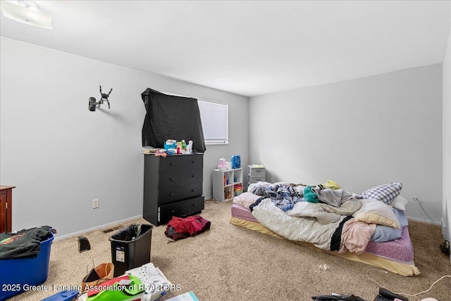 carpeted bedroom with baseboards