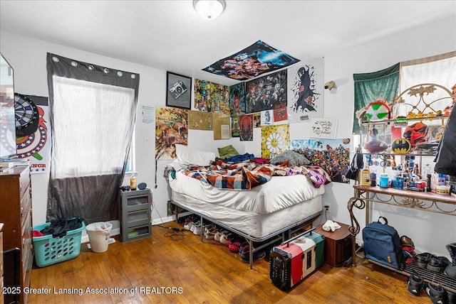 bedroom with wood finished floors