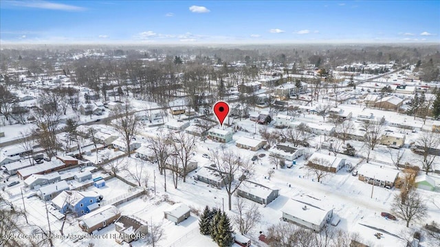 snowy aerial view with a residential view