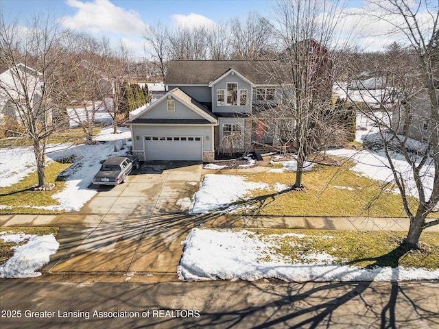 traditional home featuring a garage, concrete driveway, and brick siding