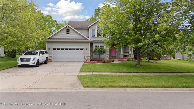 11610 Hibiscus Ln, Grand Ledge, MI 48837 - view of front of house featuring stone siding, concrete driveway, a garage, a front yard, and roof with shingles