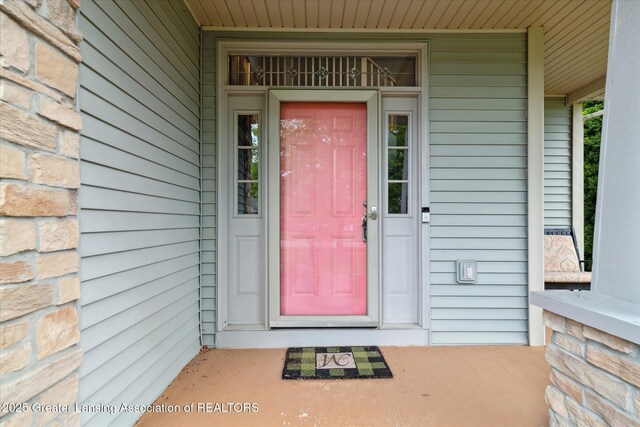11610 Hibiscus Ln, Grand Ledge, MI 48837 - entrance to property featuring covered porch